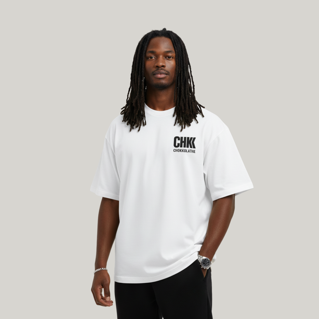 Person wearing a white t-shirt with 'CHK' logo on a gray background