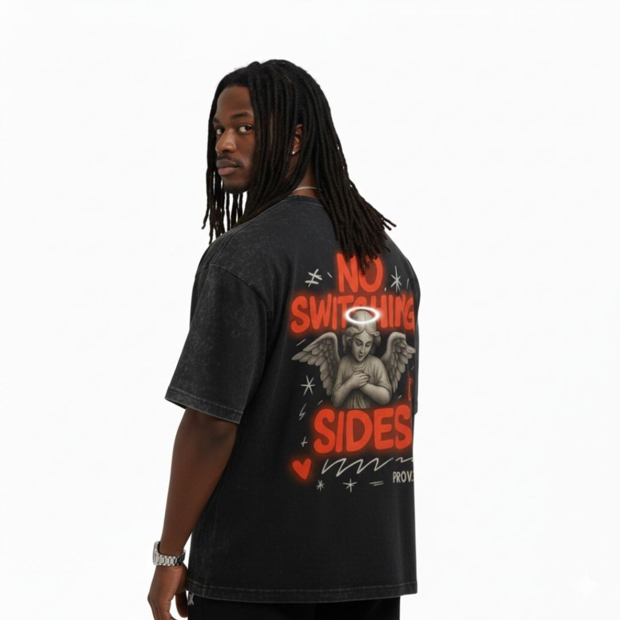 Person wearing a black t-shirt with red and white graphics and text on a white background